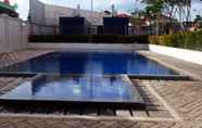 Swimming Pool 3 Minimalist and Fully Furnished Studio at Tifolia Apartment By Travelio