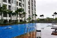 Swimming Pool Simply Furnished Studio at Saveria Apartment By Travelio