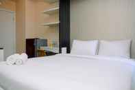 Bedroom Comfy Studio Apartment at Green Pramuka with City View By Travelio
