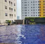 Swimming Pool 3 Comfy Studio Apartment at Green Pramuka with City View By Travelio
