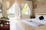 Phòng ngủ Aqua Nhu Huynh Hotel
