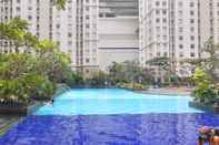 Kolam Renang Sea and Port View 2BR at Green Bay Pluit Apartment By Travelio