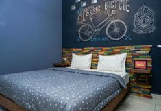 Bedroom 2 Warm and Cozy Tamu Ibu Guest House with Pool