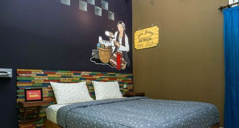 Bedroom 2 Warm and Cozy Tamu Ibu Guest House with Pool