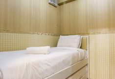 Bedroom 2 Homey 2BR with Sofa Bed Green Pramuka Apartment By Travelio