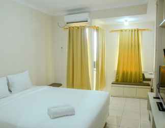 Bedroom 2 Simple Studio Room at Grand Serpong Apartment By Travelio