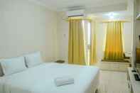 Bedroom Simple Studio Room at Grand Serpong Apartment By Travelio
