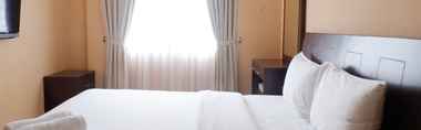 Bedroom 2 Homey 2BR Cosmo Terrace Apartment with Direct Access to Thamrin City Mall By Travelio