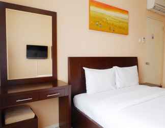 Bedroom 2 Homey 2BR Cosmo Terrace Apartment with Direct Access to Thamrin City Mall By Travelio