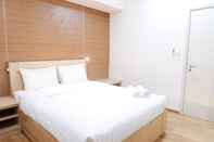 Bedroom Simple 1BR Casa Grande Apartment with Sofabed Connected to Kota Kasablanka By Travelio