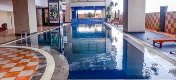 Swimming Pool 5 Comfy 2BR Apartment @ Mangga Dua Residence near ITC Mall By Travelio