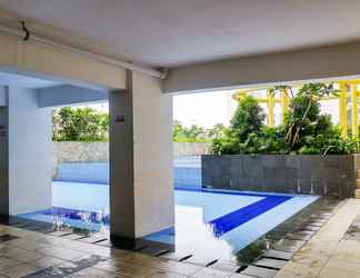 Lobi 2 Nice and Compact 2BR Bassura City Apartment near Jatinegara By Travelio