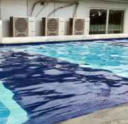 Swimming Pool 5 Exquisite Cozy 2BR Bassura City Apartment near Shopping Mall By Travelio