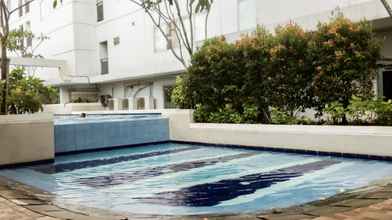 Swimming Pool 4 Exquisite Cozy 2BR Bassura City Apartment near Shopping Mall By Travelio