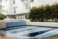 Kolam Renang Exquisite Cozy 2BR Bassura City Apartment near Shopping Mall By Travelio