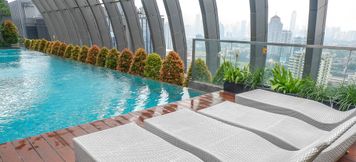Swimming Pool 3 Clean 1BR L'Avenue Apartment By Travelio