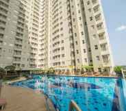 Swimming Pool 2 Minimalist Style 2BR Apartment at Parahyangan Residence By Travelio