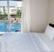 Bilik Tidur 2 Bright 1BR with City View Apartment at Cosmo Mansion By Travelio