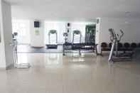 Fitness Center Clean and Lavish Design 1BR Dago Suites Apartment By Travelio