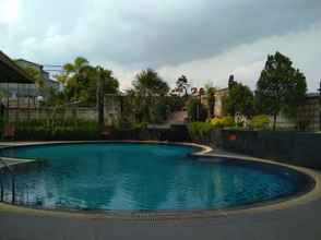 Swimming Pool 4 Exclusive and Antique 3BR at Grand Setiabudi Apartment By Travelio