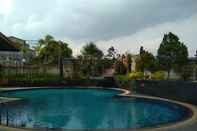 Swimming Pool Exclusive and Antique 3BR at Grand Setiabudi Apartment By Travelio