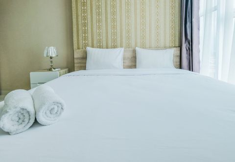 Bedroom Cozy and Comfort 1BR Brooklyn Alam Sutera Apartment By Travelio
