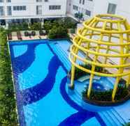 Swimming Pool 4 Modern and Comfy 2BR Bassura City Apartment By Travelio