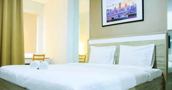 Kamar Tidur Cozy and Comfortable Studio Springwood Apartment By Travelio