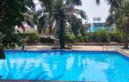 Kolam Renang 4 Relaxing and Pleasant 2BR with Pool View Mutiara Bekasi Apartment By Travelio