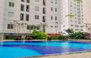 Swimming Pool 3 Mall View 2BR at Bassura City Apartment By Travelio