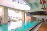 Swimming Pool Enjoy Living 1BR Apartment at Atlanta Residence By Travelio