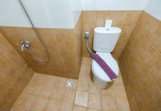 In-room Bathroom 2 Deluxe Studio Green Pramuka City a Serene Apartment Living By Travelio