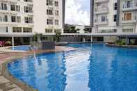 Swimming Pool Tranquil and Modern 1BR @ Casa De Parco Apartment By Travelio