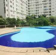 Kolam Renang 2 Cozy 1BR + 1 Apartment at Seasons City By Travelio