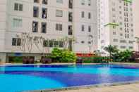 Kolam Renang Fully Furnished 1BR at Bassura City Apartment By Travelio