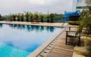 Swimming Pool 3 Relax and Cozy Studio Room at Tree Park BSD Apartment By Travelio