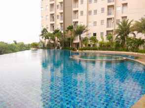 Swimming Pool 4 Luxury 1BR Apartment at Mustika Golf Residence with Golf View By Travelio