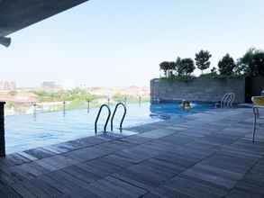 Swimming Pool 4 Minimalist Style 2BR at Tamansari Papilio Apartment By Travelio