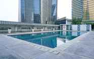 Swimming Pool 4 Relax & Cozy 2BR at The Empyreal Condominium Epicentrum Apartment By Travelio