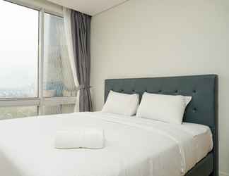 Bedroom 2 Relax & Cozy 2BR at The Empyreal Condominium Epicentrum Apartment By Travelio