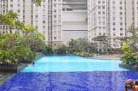 Swimming Pool Convenient and Stylish 2BR Green Bay Pluit Apartment By Travelio