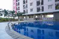 Swimming Pool Well Furnished Studio at Green Park View Apartment By Travelio