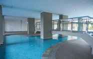 Swimming Pool 3 Well Furnished Studio at Green Park View Apartment By Travelio