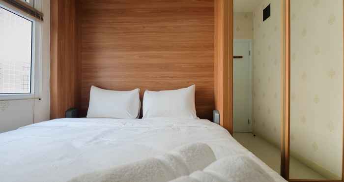 Bedroom Near Shopping Mall 2BR at Green Pramuka City Apartment By Travelio