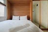 Bedroom Near Shopping Mall 2BR at Green Pramuka City Apartment By Travelio