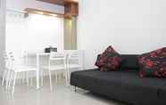 Common Space 2 Pleasant and Comfort 1BR Apartment with Sofa Bed at Dago Suites By Travelio