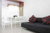 Common Space Pleasant and Comfort 1BR Apartment with Sofa Bed at Dago Suites By Travelio