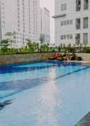 SWIMMING_POOL 2BR Simple and Minimalist Style Bassura City Apartment By Travelio