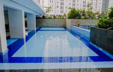 Swimming Pool 2  Fully Furnished and Simply Style 2BR Bassura City Apartment By Travelio