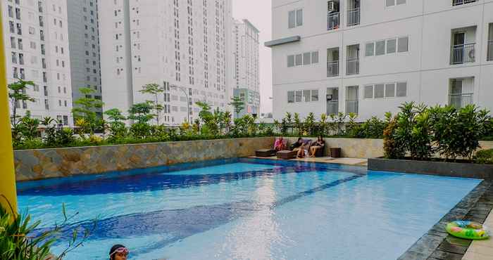 Swimming Pool  Fully Furnished and Simply Style 2BR Bassura City Apartment By Travelio
